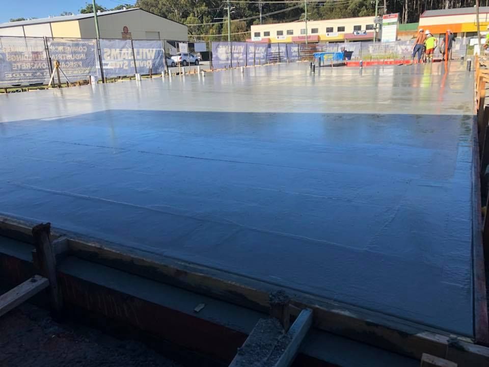 A Large Concrete Floor Is Being Built On A Construction Site — Luke Seears Concreting in Lake Cathie, NSW