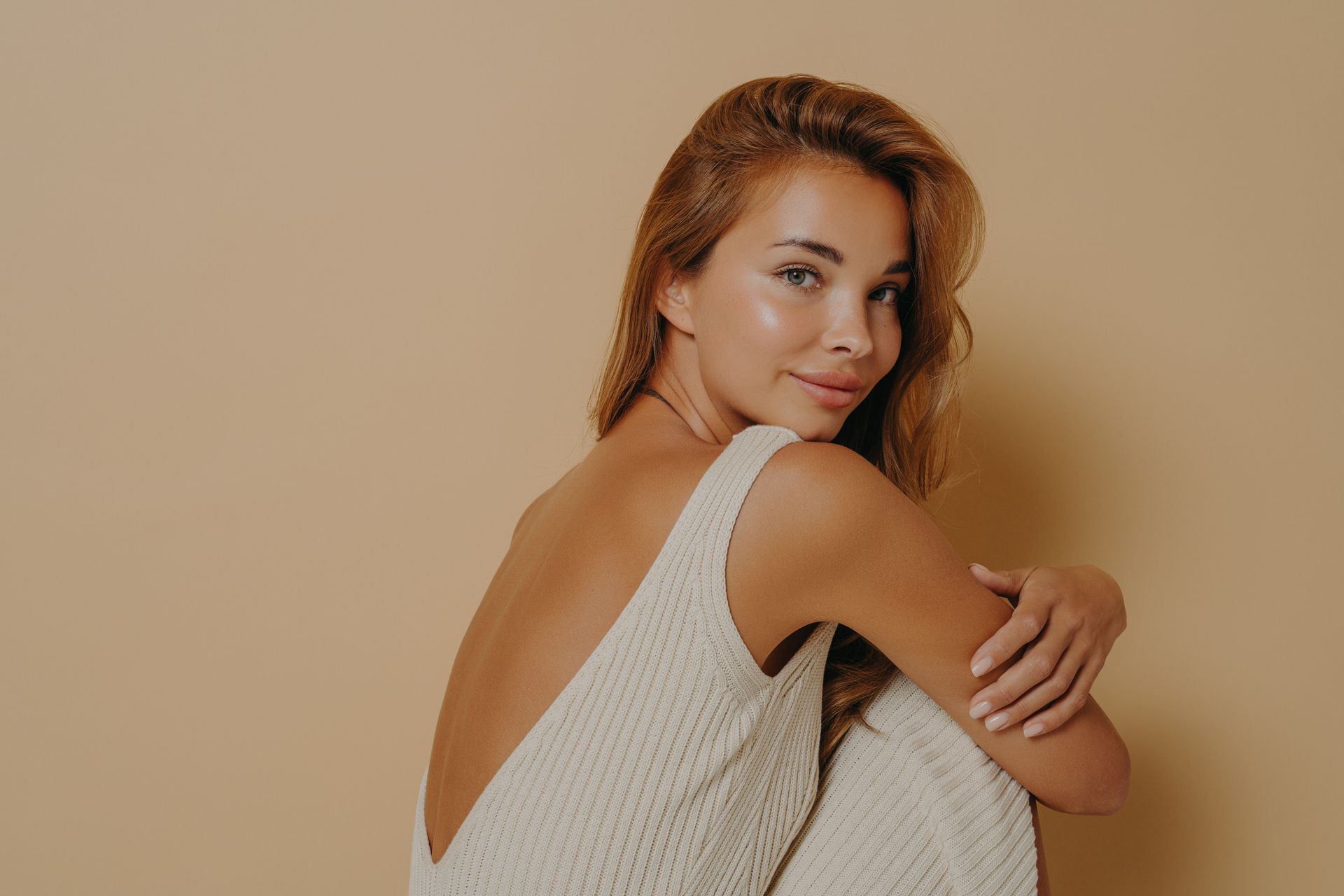 A man and a woman are smiling for the camera.