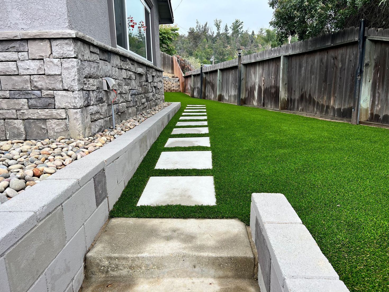 white stepping stones and turf