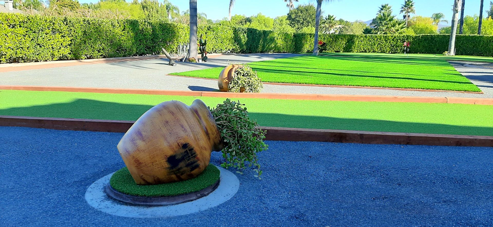 pots near artificial grass bocce ball