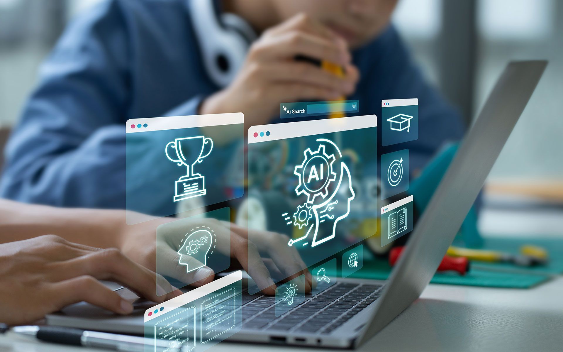 Person using laptop with overlaid AI and coding icons, another person in the background.