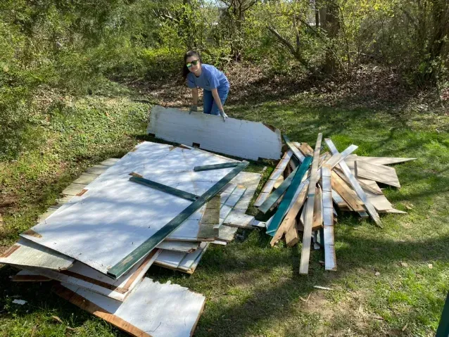 scrap plywood in yard, demolition debris cleanup