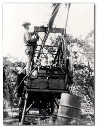 Mr. Glass working on old time water well