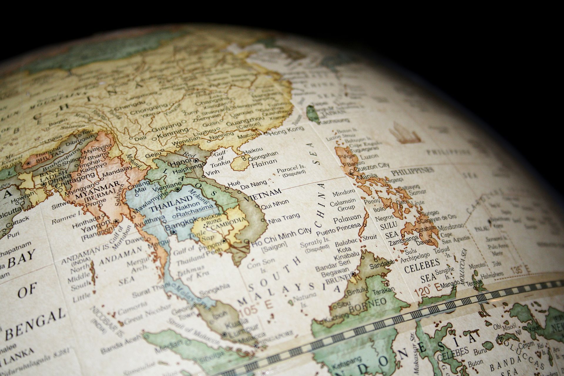 Globe showing Southeast Asia, including Vietnam, Thailand, and the Philippines. Antique, textured map.