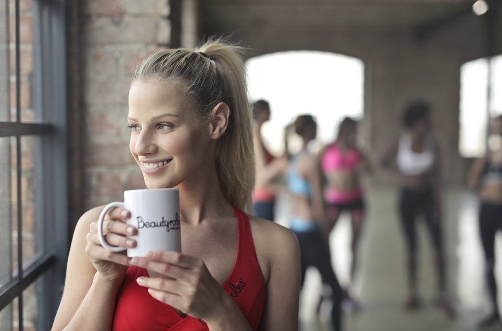 Smiling Woman Holding a Mug