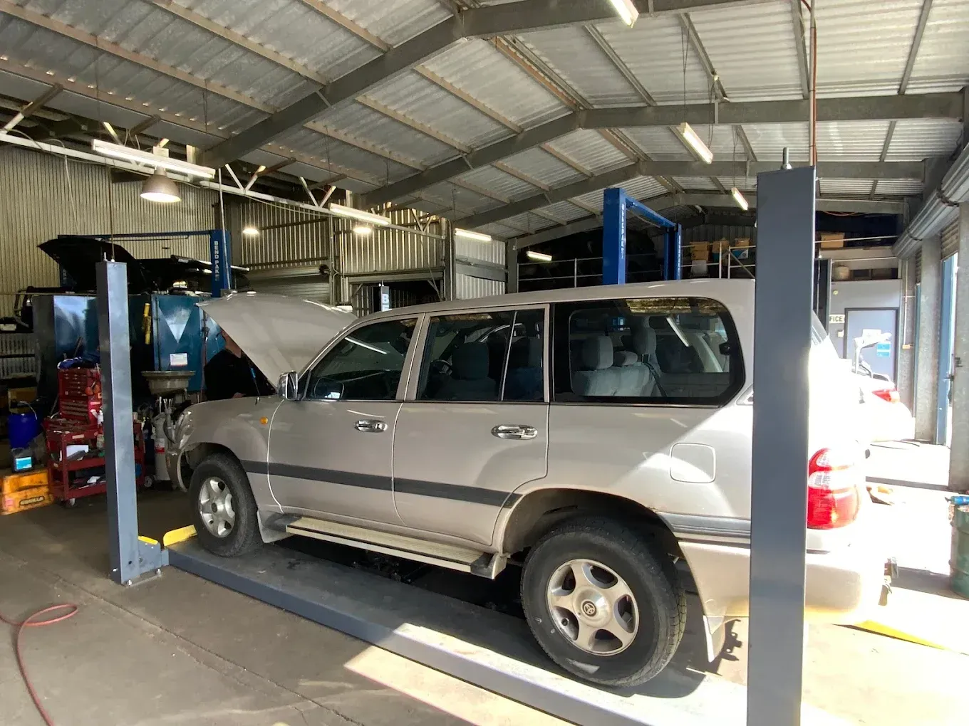 An Orange Car — Toowoomba Lube & Mechanical in Glenvale, QLD