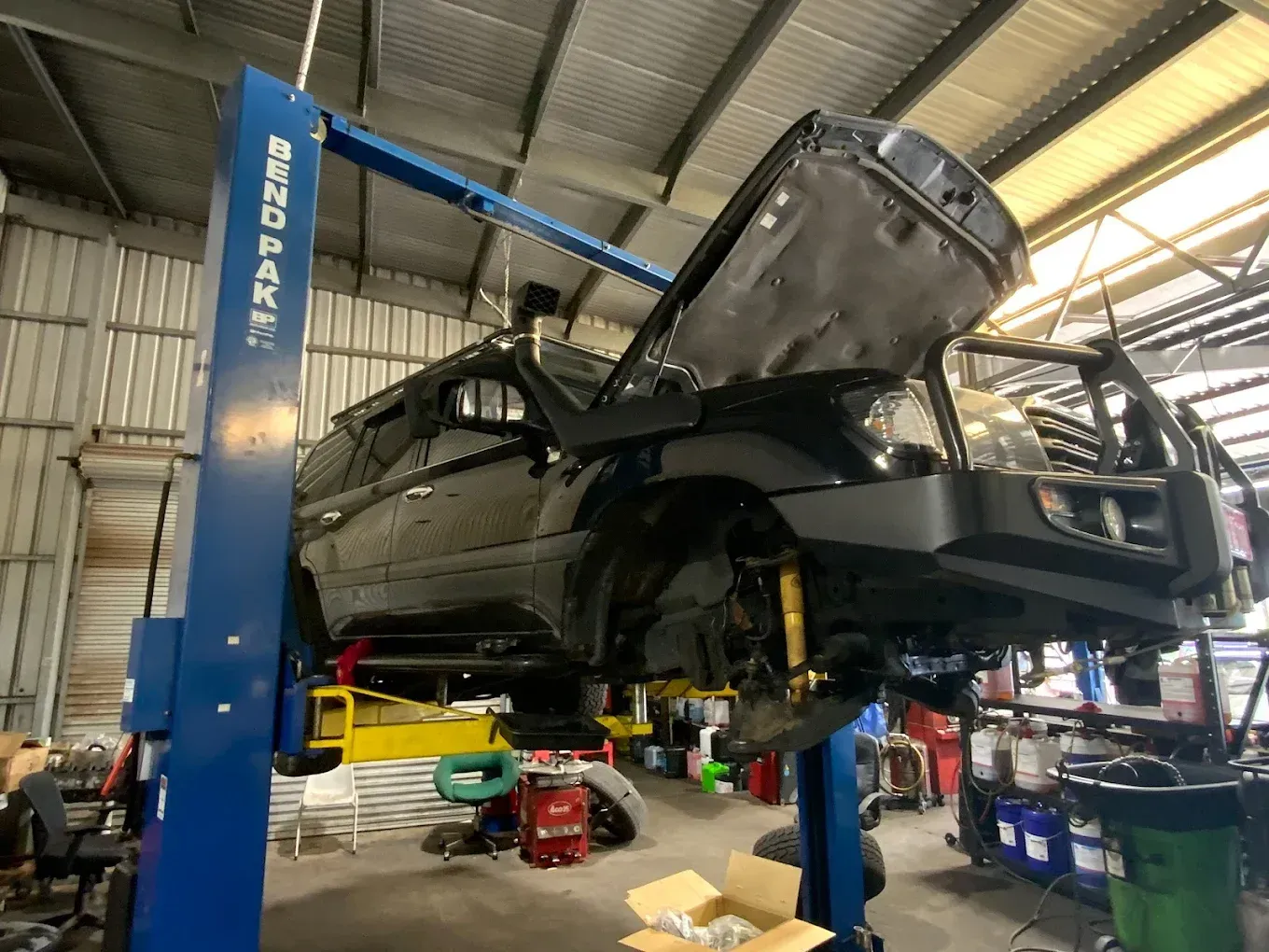 A Close Up of a Car Engine With the Hood Open — Toowoomba Lube & Mechanical in Glenvale, QLD