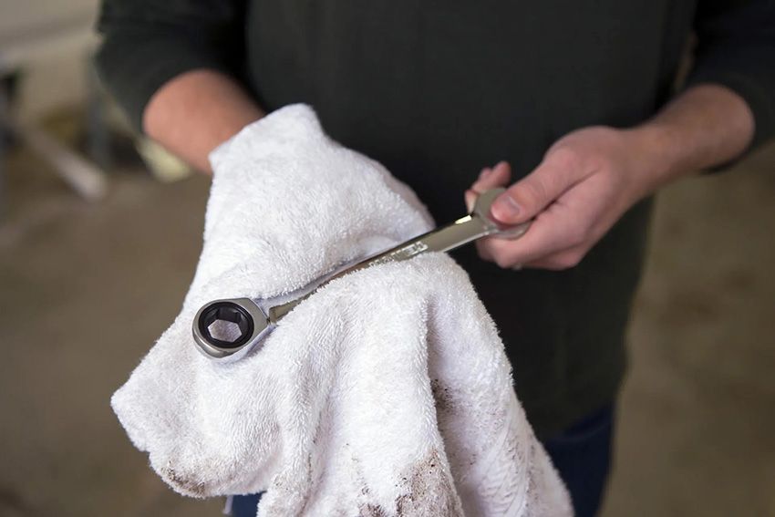 A Person is Holding a Wrench on a Towel — Toowoomba Lube & Mechanical in Glenvale, QLD