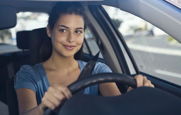Woman behind the wheel of a car taking driving classes in Liberty Township, OH