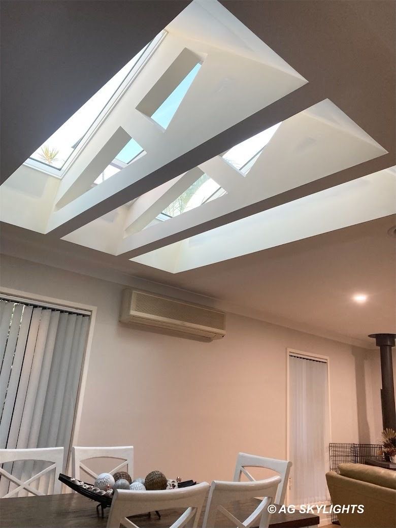 Large skylights in the kitchen above a dining table — AG Skylights in Central Coast, NSW
