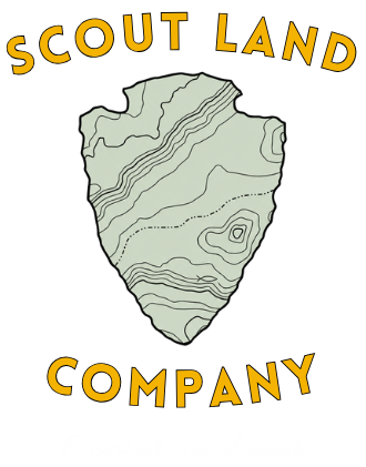 A logo for scoutland company with a shield on a white background