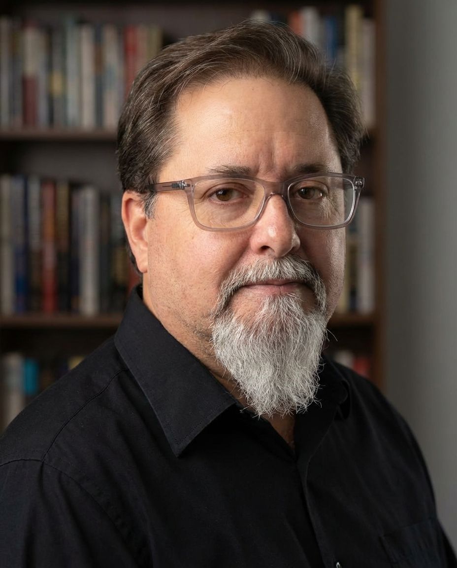 A man in a green shirt is smiling for the camera