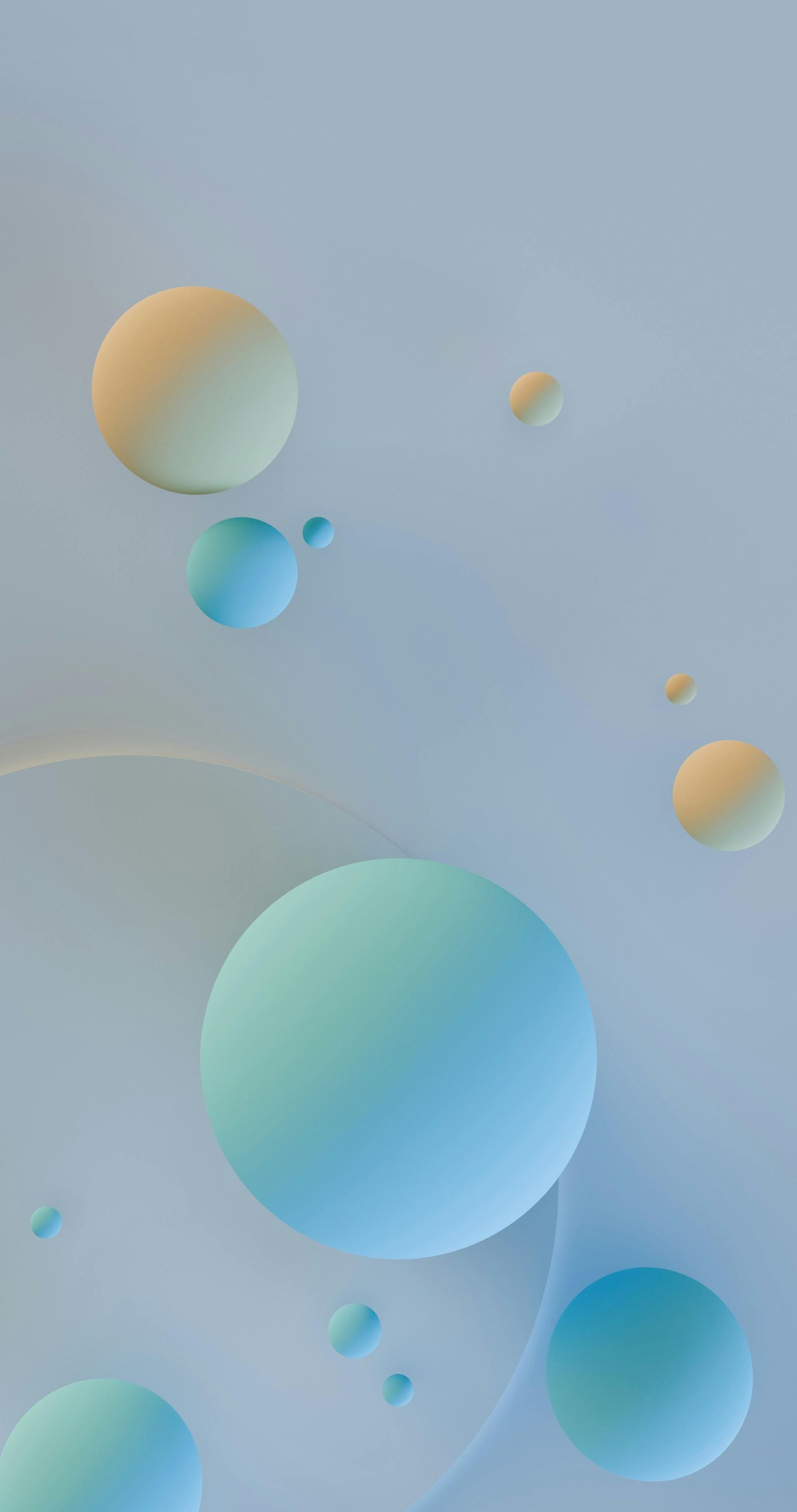 Abstract background with various sized, soft-focus blue and yellow spheres floating on a smooth, light blue surface.