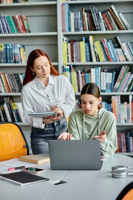 A woman is teaching a girl