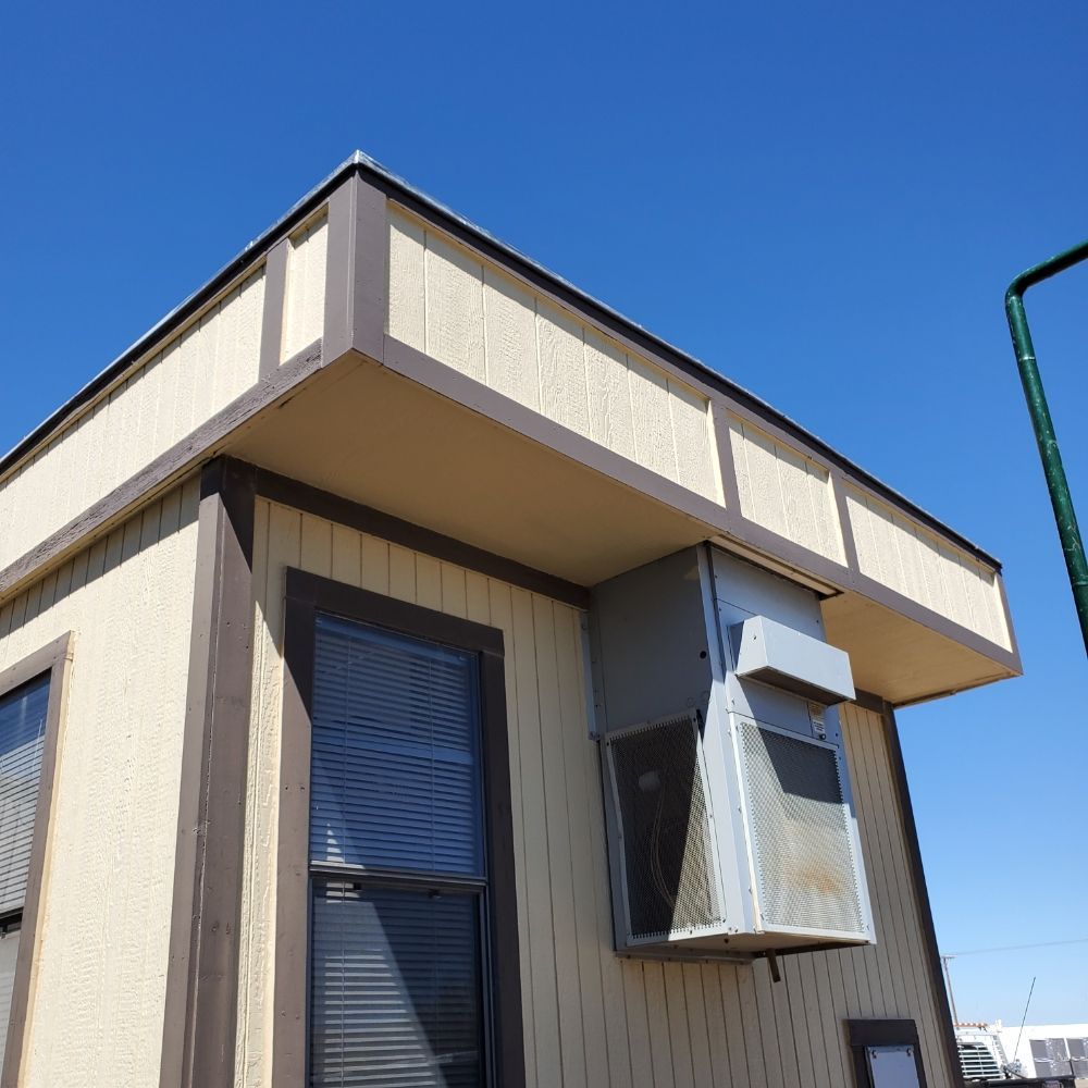 A building with a roof that has a window on it