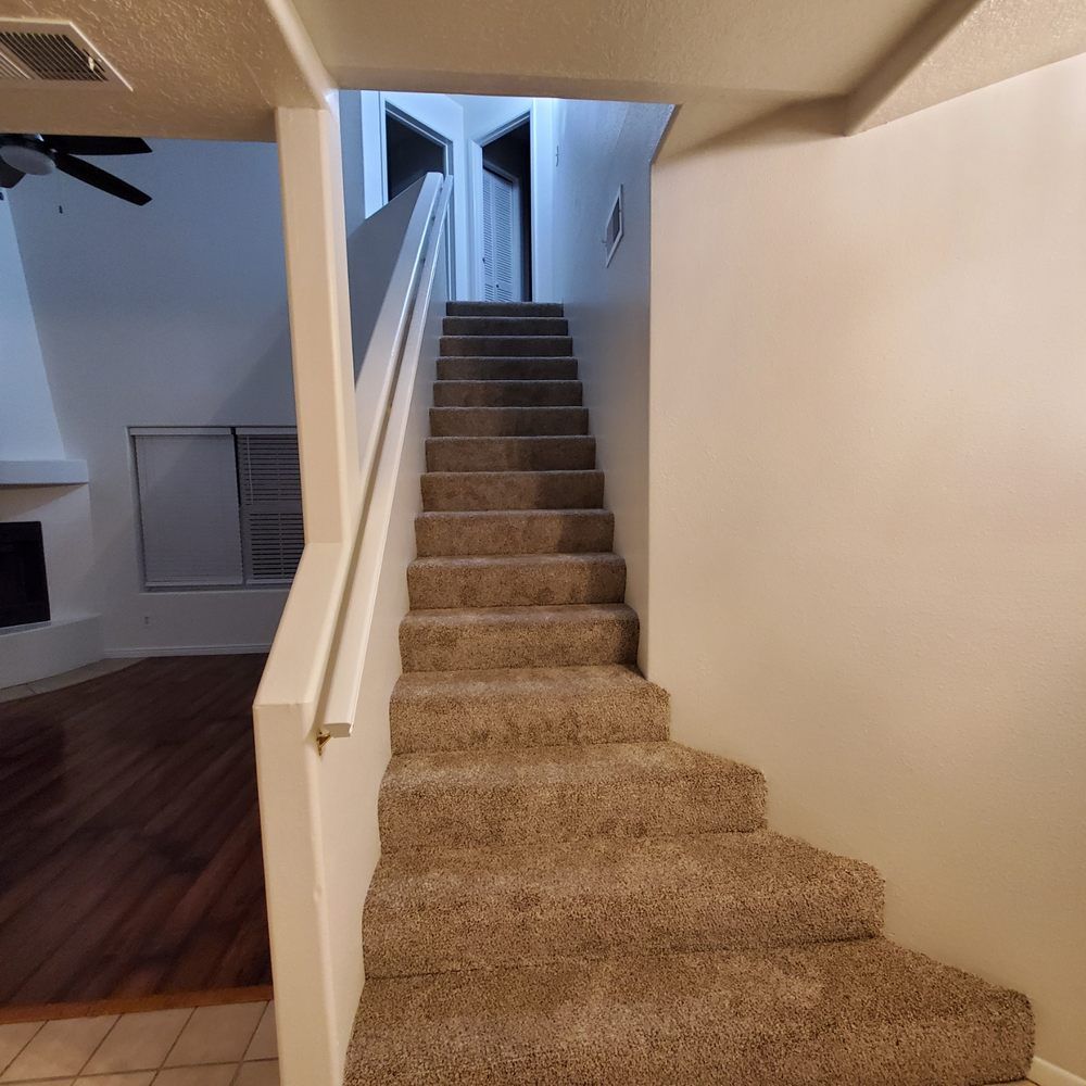 A set of stairs leading up to the second floor of a house