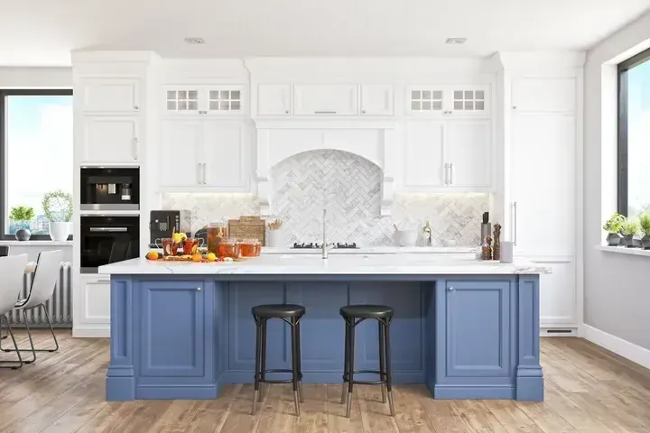 A kitchen with blue cabinets and white cabinets and a large island.