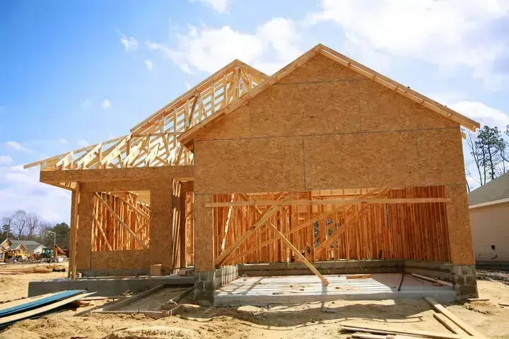 A house is being built in a residential area.