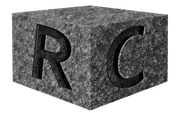 Gray stone cube with carved-out letters 