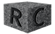 Gray stone cube with carved-out letters 