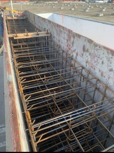 A large metal container with a lot of metal bars in it.