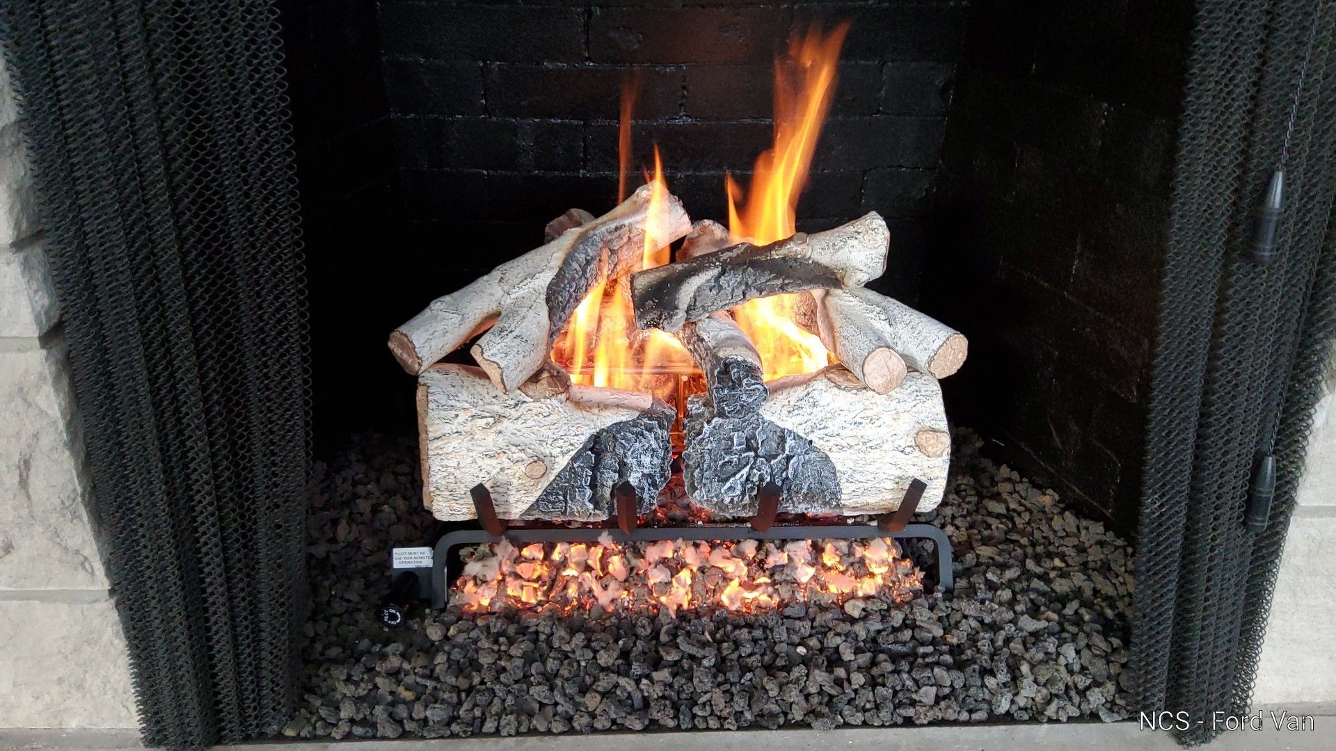 A fireplace with flames coming out of it