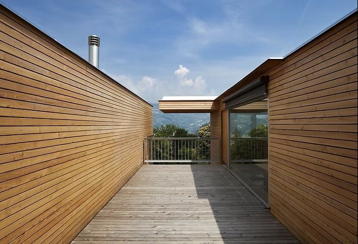A wooden deck in the middle of a house