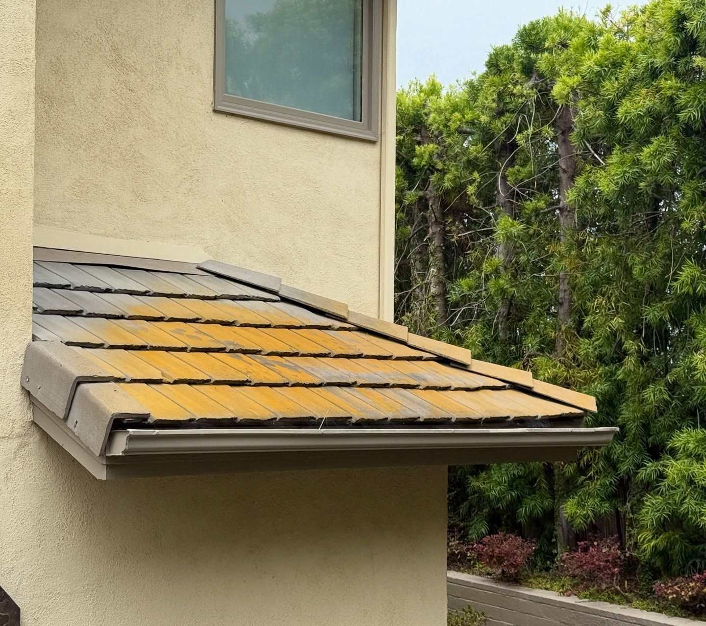 A house with a roof that looks like wood