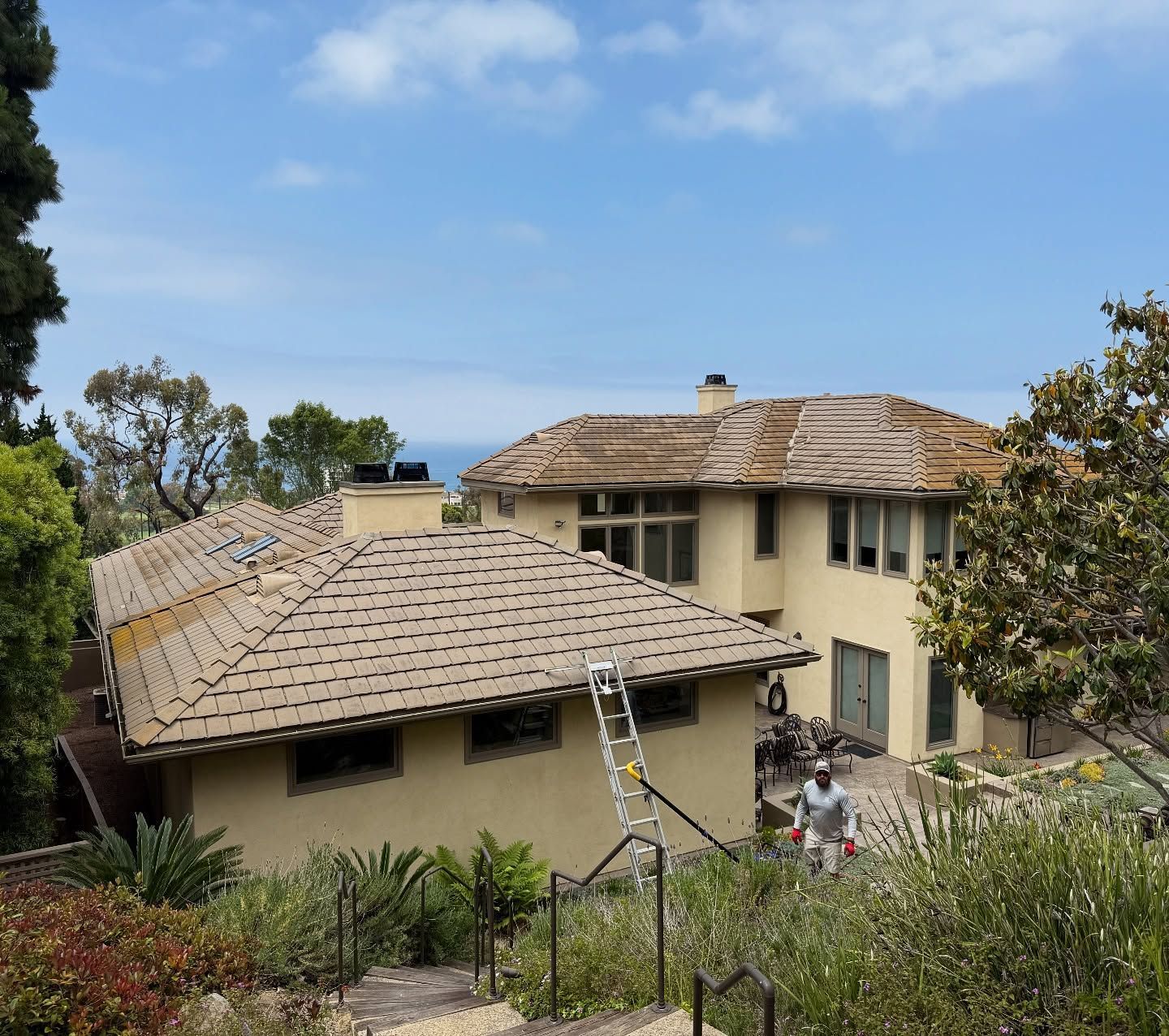 A large house with a ladder in front of it