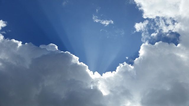 Sunlight breaking through clouds in El Cenizo, TX, funeral homes use peaceful sky imagery like this to symbolize hope, comfort, and remembrance during memorial services.