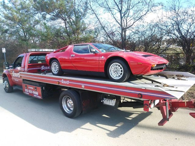 Red Car On Pink Towing - Milford, OH - Sora’s Towing, Inc.
