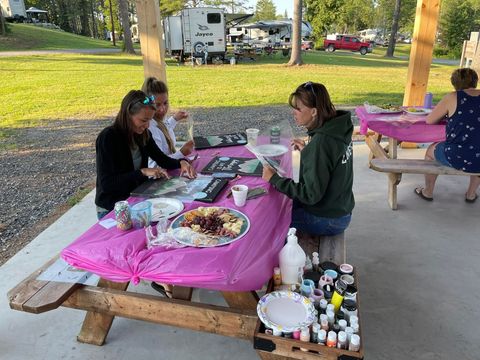 A group of people are sitting at a picnic table.