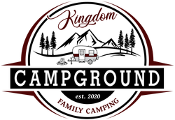 A logo for Kingdom Campground family camping with a camper and mountains in the background.