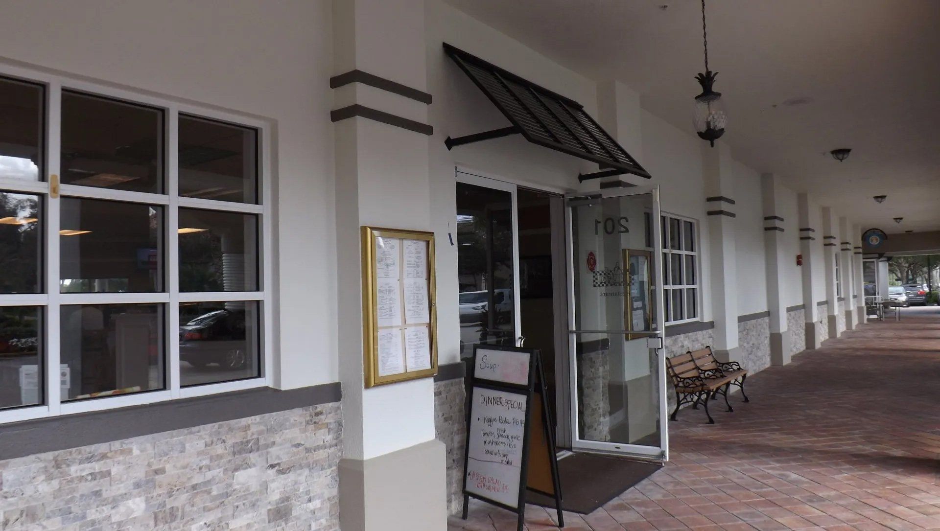 Bahama Shutter In Store Front — Naples, FL — Naples Awning