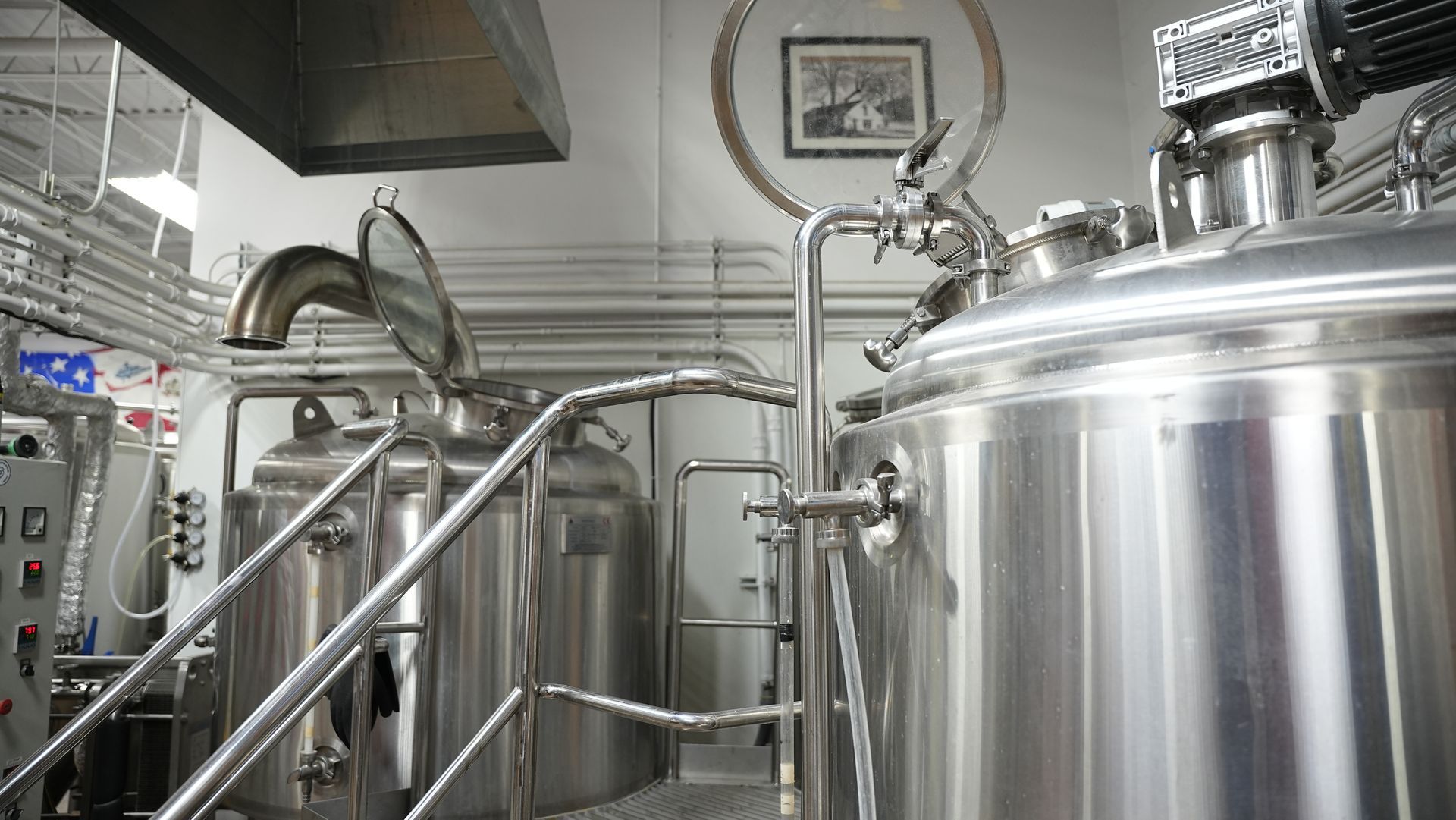 The 5x5 brewery with lots of stainless steel tanks and pipes.