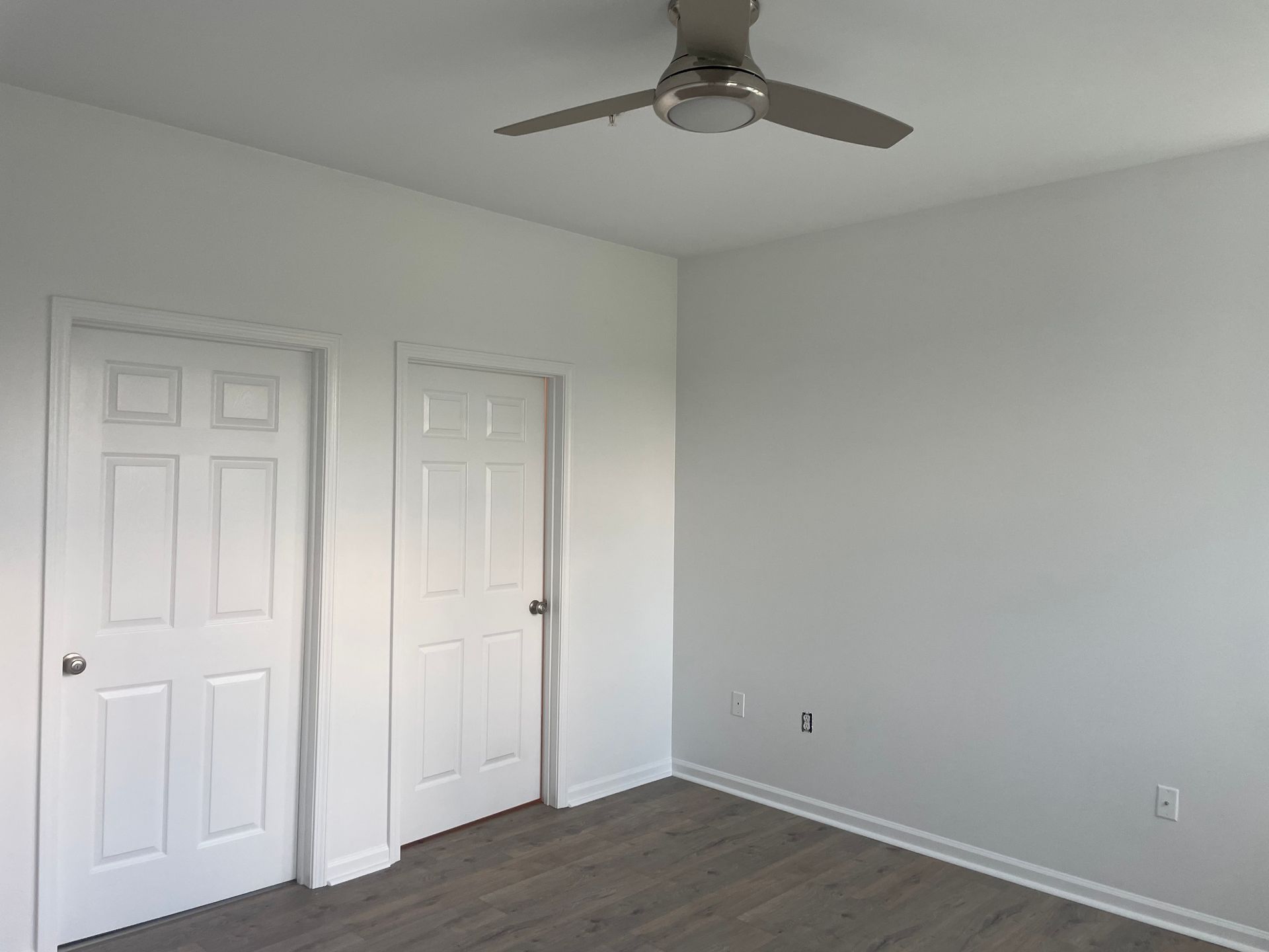 An image showing a person repairing drywall.