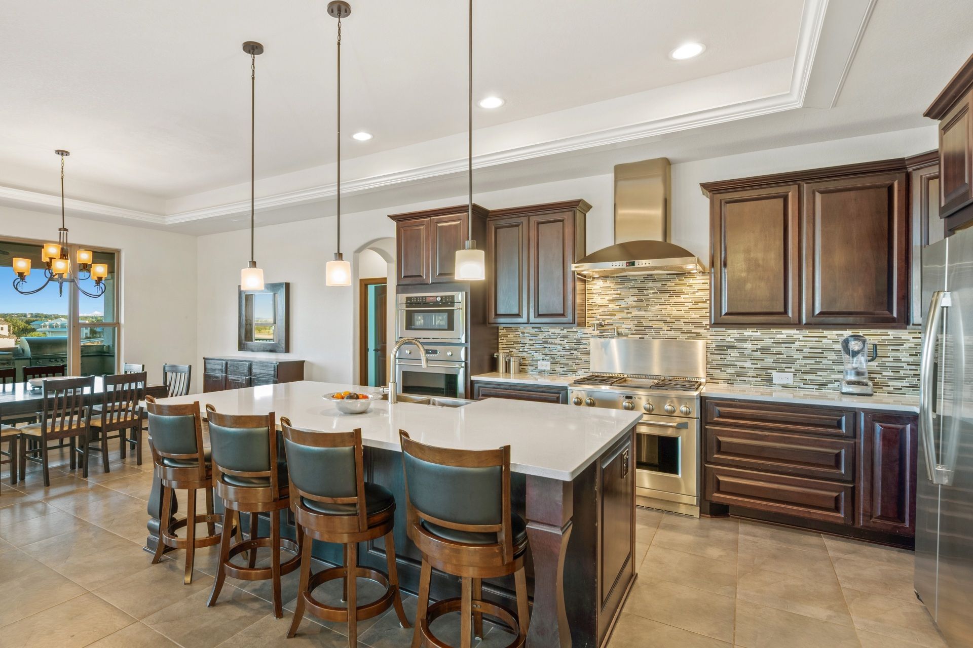 There is a large island in the middle of the kitchen.