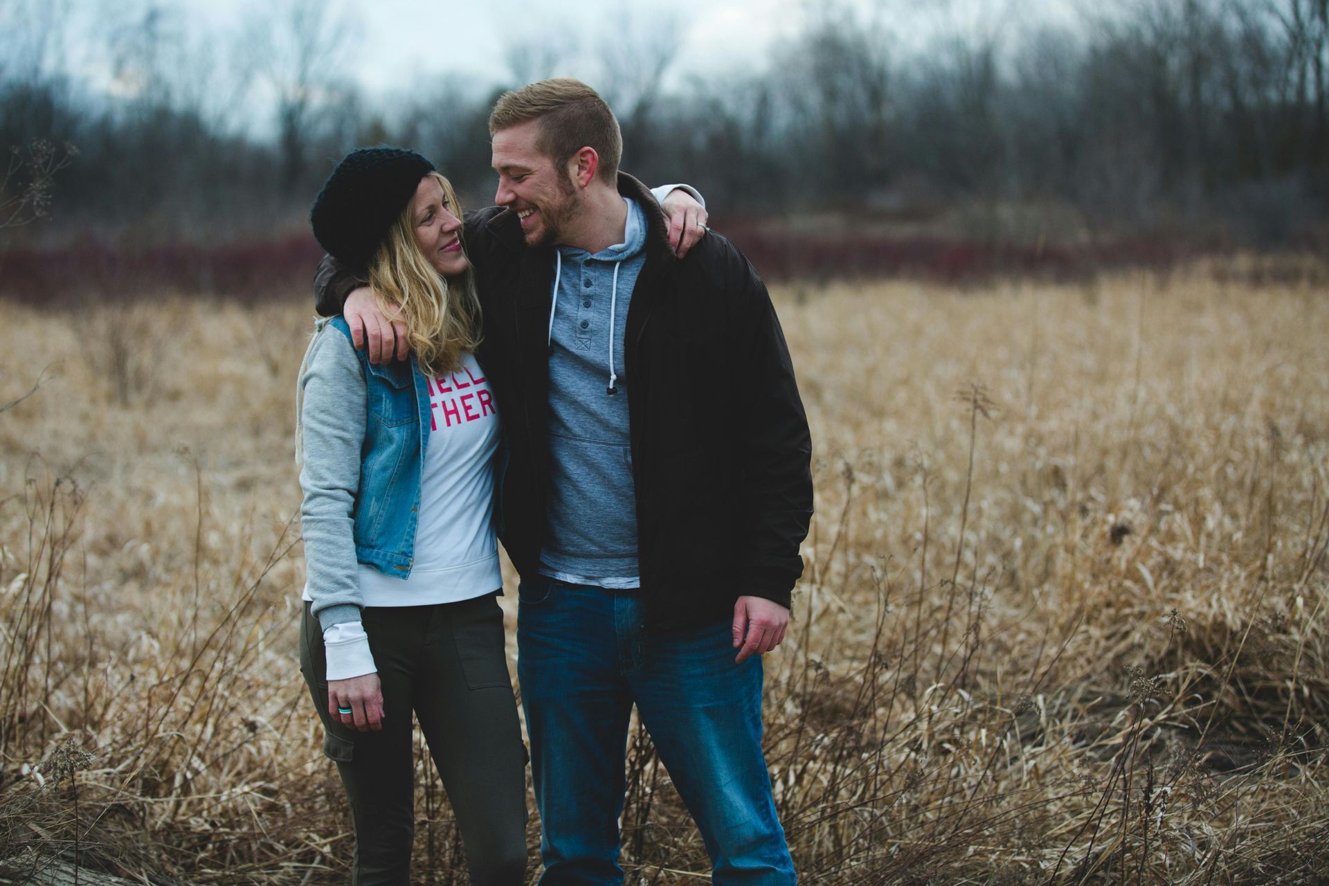 man and woman embracing and smiling