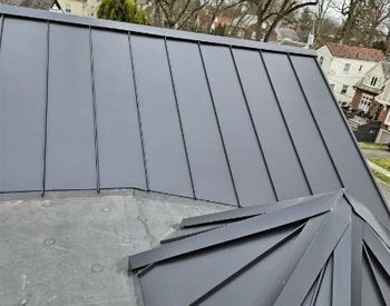 a close up of a gray metal roof on a house