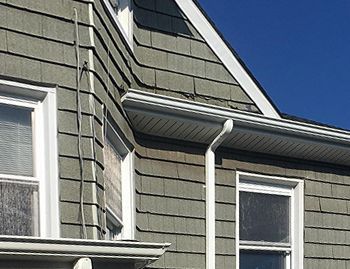 a house with a ladder on the side of it