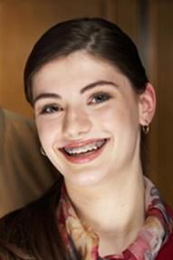 woman smile with braces- Lincoln, NE - Blome Family Dentistry