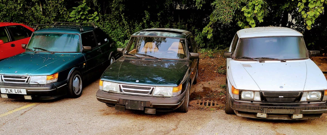 Old Green Car Parked Beside Other Vehicles | K & N Automotive