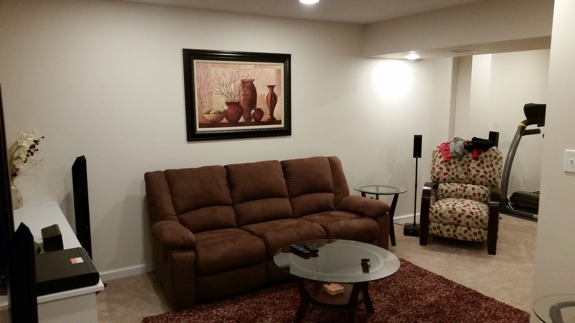 A living room with a couch a chair and a coffee table