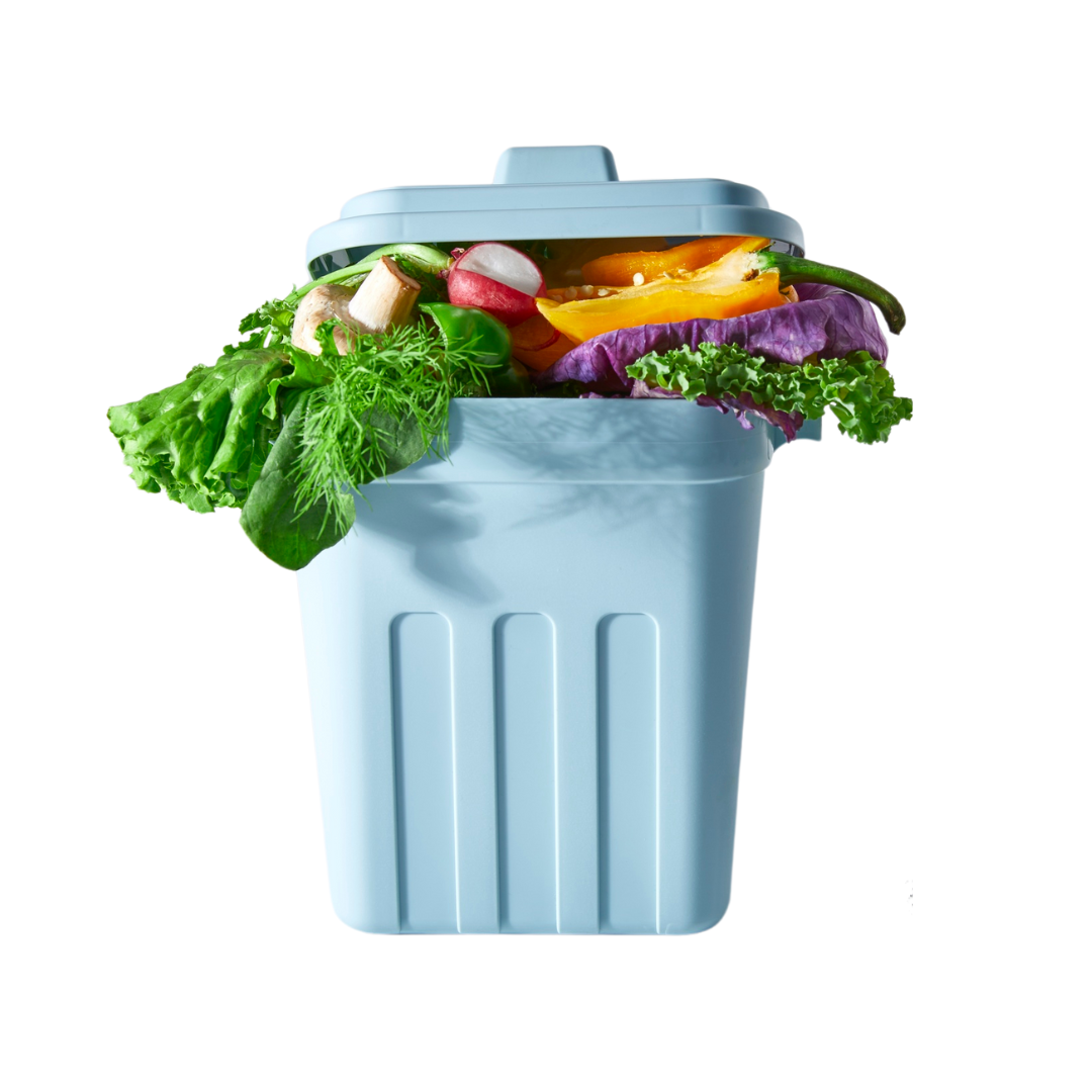 A blue trash can filled with vegetables on a white background.