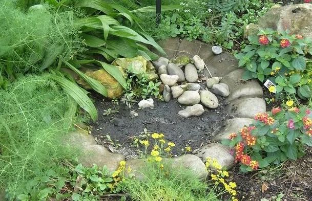butterfly puddle station made with rocks