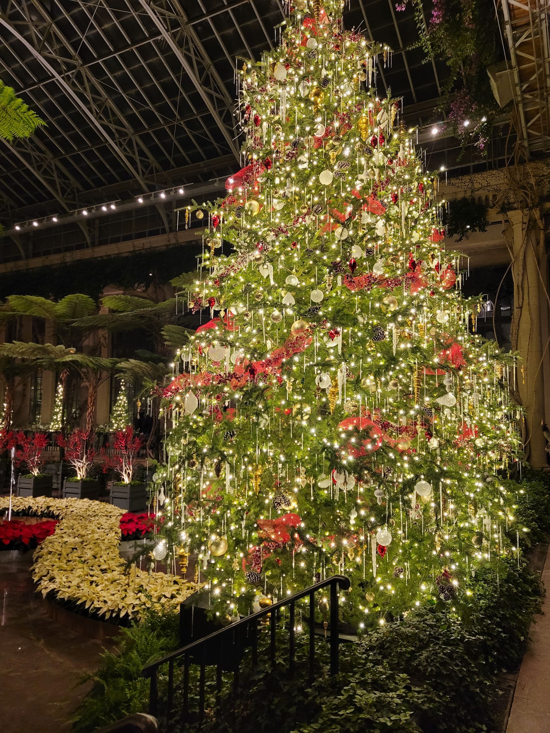 A large christmas tree with lots of lights and decorations