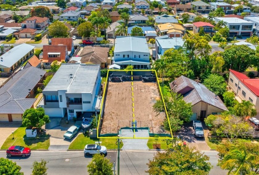 An aerial view of a residential area with lots of houses and trees