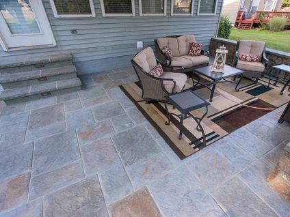 stamped concrete patio with color in Calgary back yard