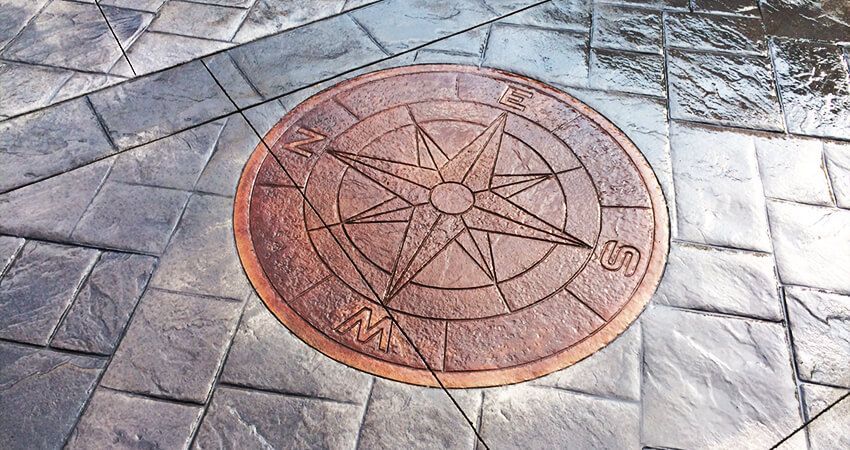 compass design in stamped concrete in calgary