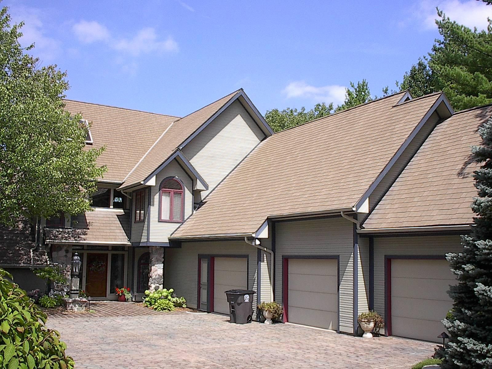 A large house with a lot of garage doors